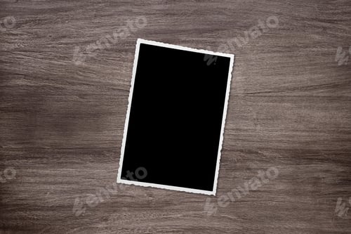 Preview: blackened old vintage photo template on wooden background