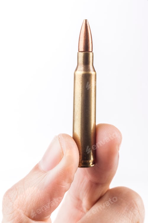 Preview: Finger Holding Up Bullet