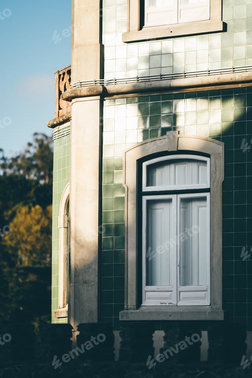 Preview: Green-tiled facade with arched windows