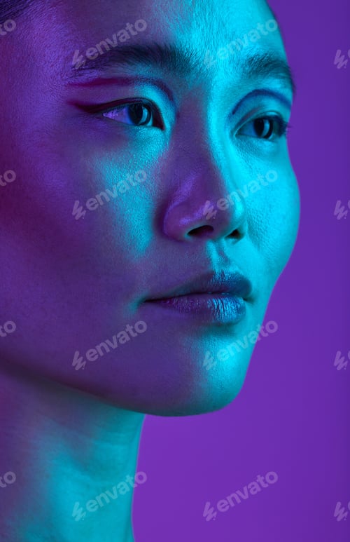 Preview: Cropped shot of an attractive young woman posing in studio against a purple background