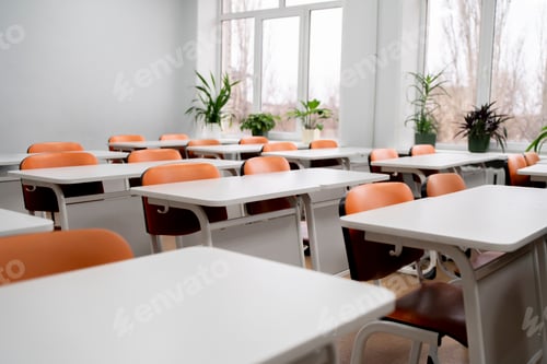 Preview: a back to school concept, empty classroom with white tables and chairs