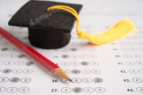 Preview: Graduation gap hat and pencil on answer sheet background, Education study testing learning teach