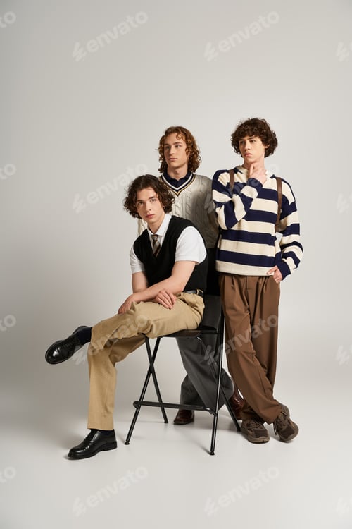 Preview: Young stylish friends showcase modern fashion trends in playful poses