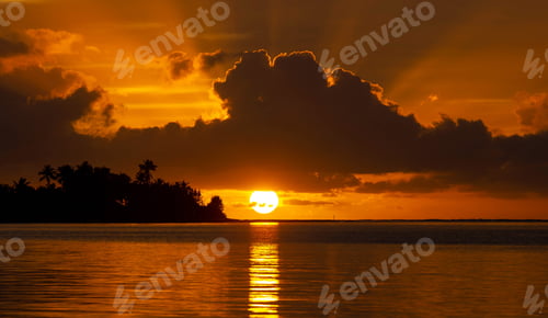 Preview: Dramatic sunrise with colorful sky as seen from the tropical island of Moorea.