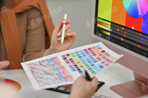 Preview: Cropped shot of designers team collaborating on new startup project at office.