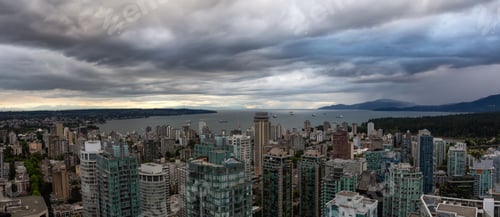 Preview: Aerial panoramic view of Downtown City during a stormy summer evening before sunset