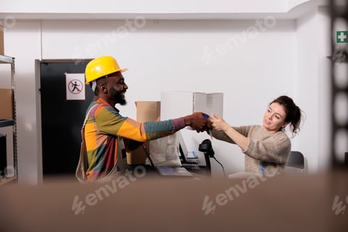 Preview: Diverse stockroom team working at customers orders