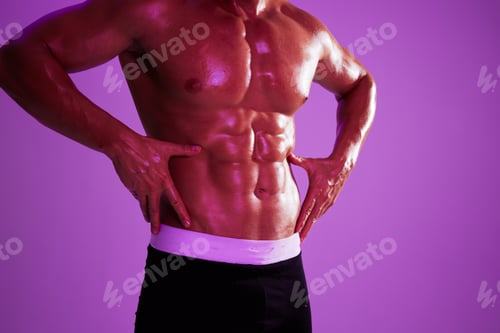 Preview: Man athletic body bodybuilder in briefs with nude torso abs full-length in the background fitness