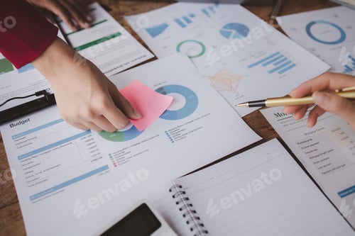 Preview: Businessman is reviewing monthly sales documents for analysis and marketing plans for more sales gro