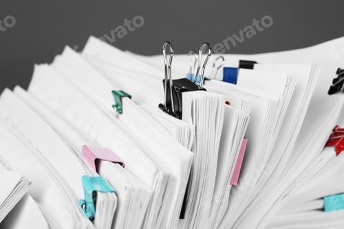 Preview: Pile of documents with colorful binder clips, closeup
