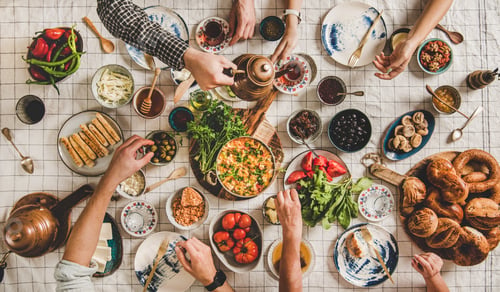 Preview: Flat-lay family having traditional Turkish breakfast with black tea