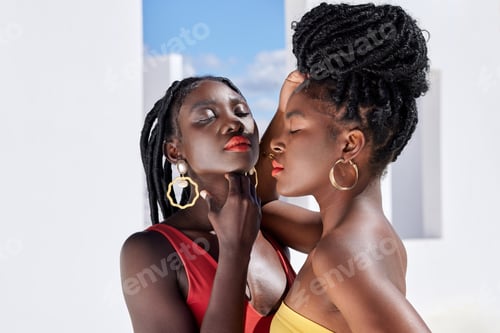 Preview: Brighten up your day. Cropped shot of two attractive young women posing on a rooftop outdoors.