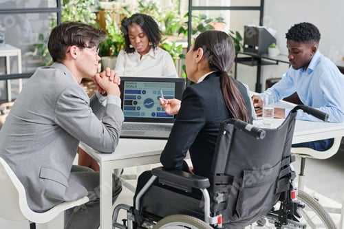 Preview: Business colleagues developing new strategy on laptop