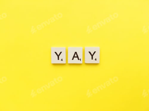 Preview: YAY scrabble letters word on a yellow background