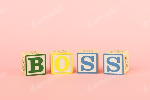 Preview: Colored cubes with letters Boss on a pink background