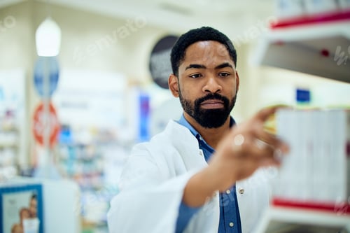 Preview: Professional Pharmacist Organizing Stock in a Modern Pharmacy Environment