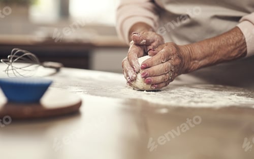 Preview: It has to be a perfect circle. Shot of an unrecognizable person baking in the kitchen at home.