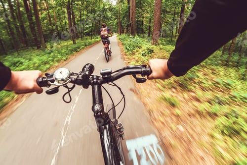 Preview: Mountain biking down hill descending fast. View from bikers eyes. Motion blurred