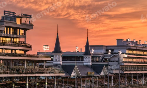 Preview: Stunning view of Churchill Downs racetrack at sunset with a colorful sky