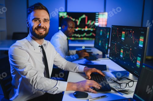 Preview: Team of traders working at monitor computer and browsing online in trading office