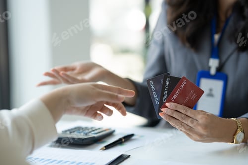 Preview: Young businesswoman, company employee presenting a form of credit limit, benefits, how to use the ca