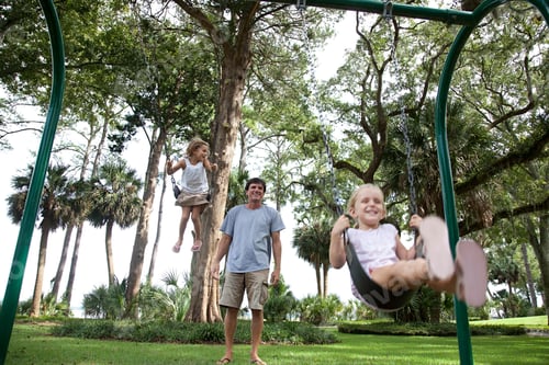 Preview: Father and daughters on swings