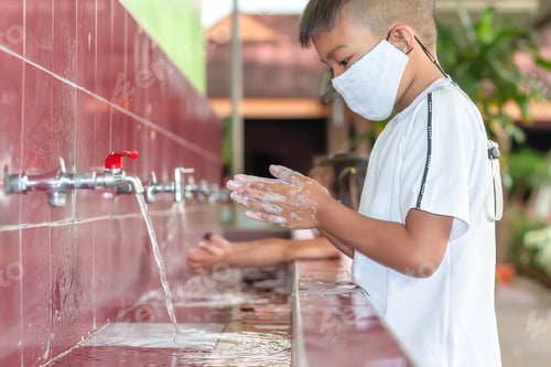 Preview: Asian child boy cleaning and washing hands by soap.