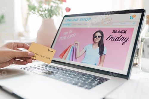 Preview: Laptop display with black friday screensaver and female hand with credit card