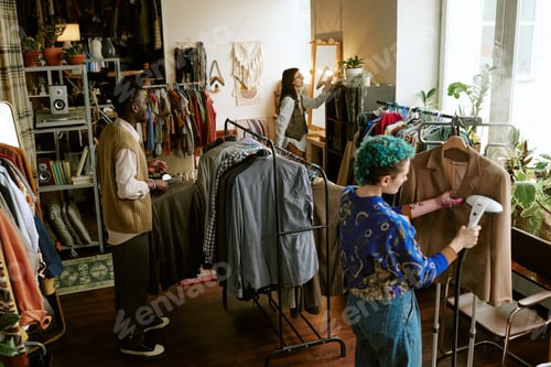 Preview: Young Multiethnic Adults Organizing and Preparing Second Hand Clothing Store