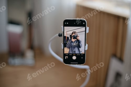 Preview: Phone in phone holder, making video or photo, social media