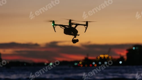 Preview: Drone flying and taking pictures of sunset in against new york skyline
