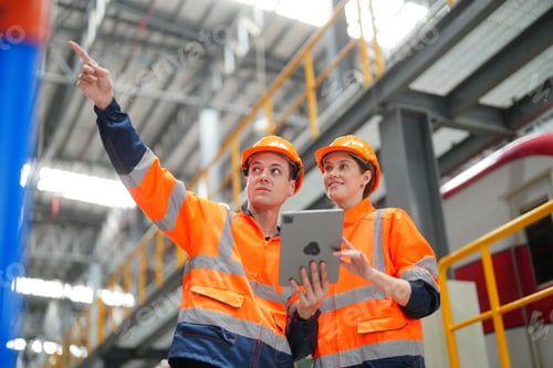 Preview: Profession, technology and people concept -The Engineer Checks The Condition Of Electric Train railw