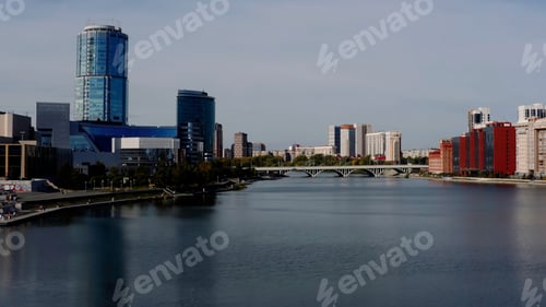 Preview: A big city with an embankment and a river. Stock footage. Bird's-eye view of tall office and