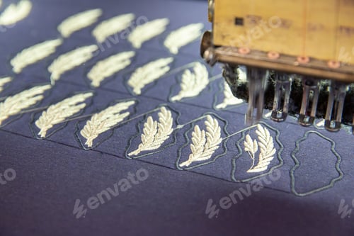 Preview: Close up with embroidery machine working on a blue matrix