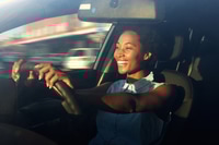 Preview: Young african american woman driving a car