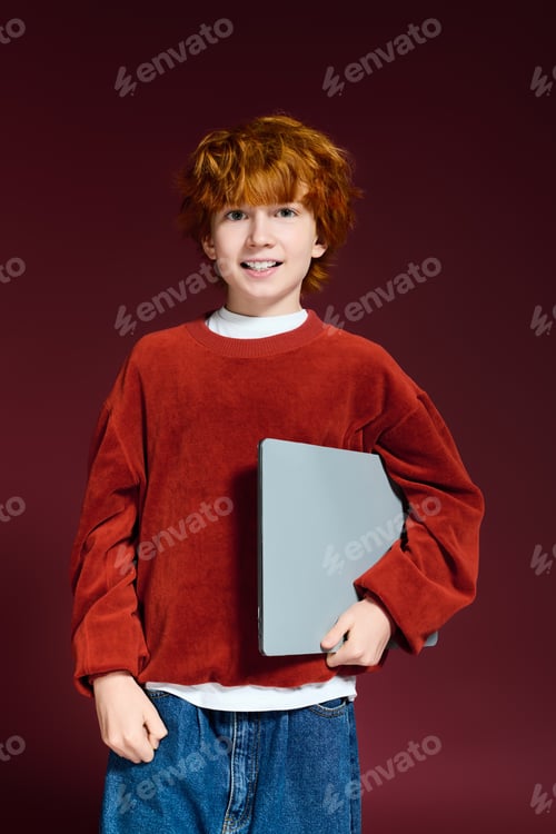 Preview: Redhead boy showcasing casual style in a vibrant studio atmosphere