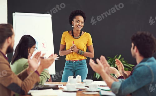 Preview: Impressing and inspiring her team. Cropped shot of people applauding together in an office.