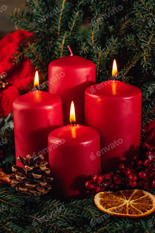 Preview: Three burning Red advent candles in advent wreath decoration on wooden dark background.