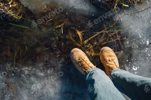 Preview: man stay on the cracked ice on the lake