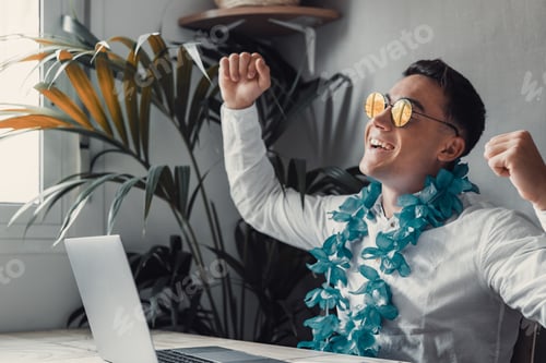 Preview: Man sit at desk read e-mail on laptop makes yes gesture feels happy