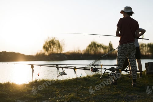 Preview: Fishing as recreation and sports displayed by fisherman at lake