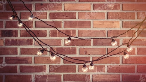 Preview: beautiful bright garland on the wonderful red brick background