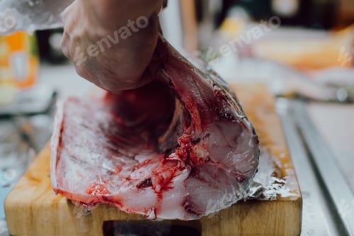 Preview: Fresh Fish on Cutting Board in Kitchen