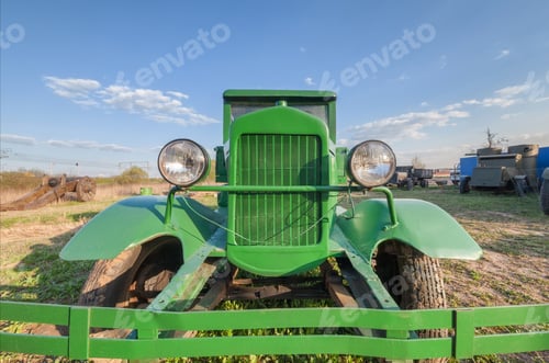 Preview: Vintage retro soviet truck green field, front view closeup