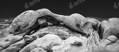 Preview: Greyscale shot of ancient stones in a deserted are