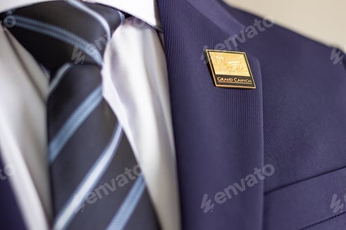 Preview: Elegant business attire with grand canyon lapel pin