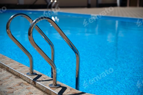 Preview: Modern outdoor luxurious swimming pool. Vacation concept