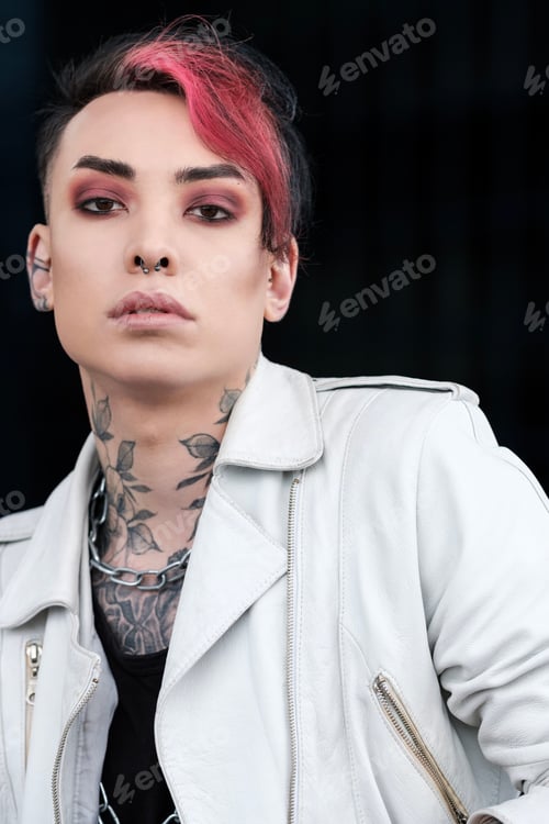 Preview: Headshot of androgynous non-binary male model looking at camera.