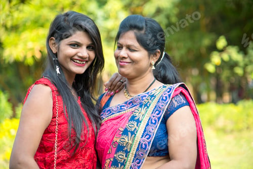 Preview: Portrait of happy mother and daughter embracing.