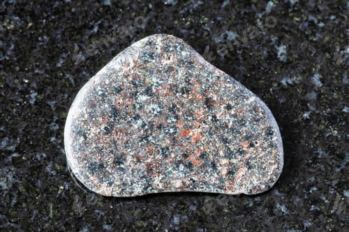 Preview: tumbled basalt with hematite mineral on black